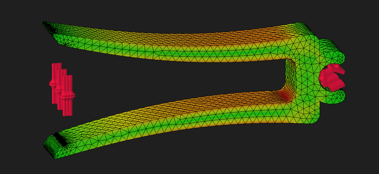 Visualization of the part, it is deformed in the way that the arms of the clip are pushed in opposite directions. The part is mostly green with some orange and red regions on the inside of the arms. The color represents the amount of stress at a specific location, green being low stress and red high stress.